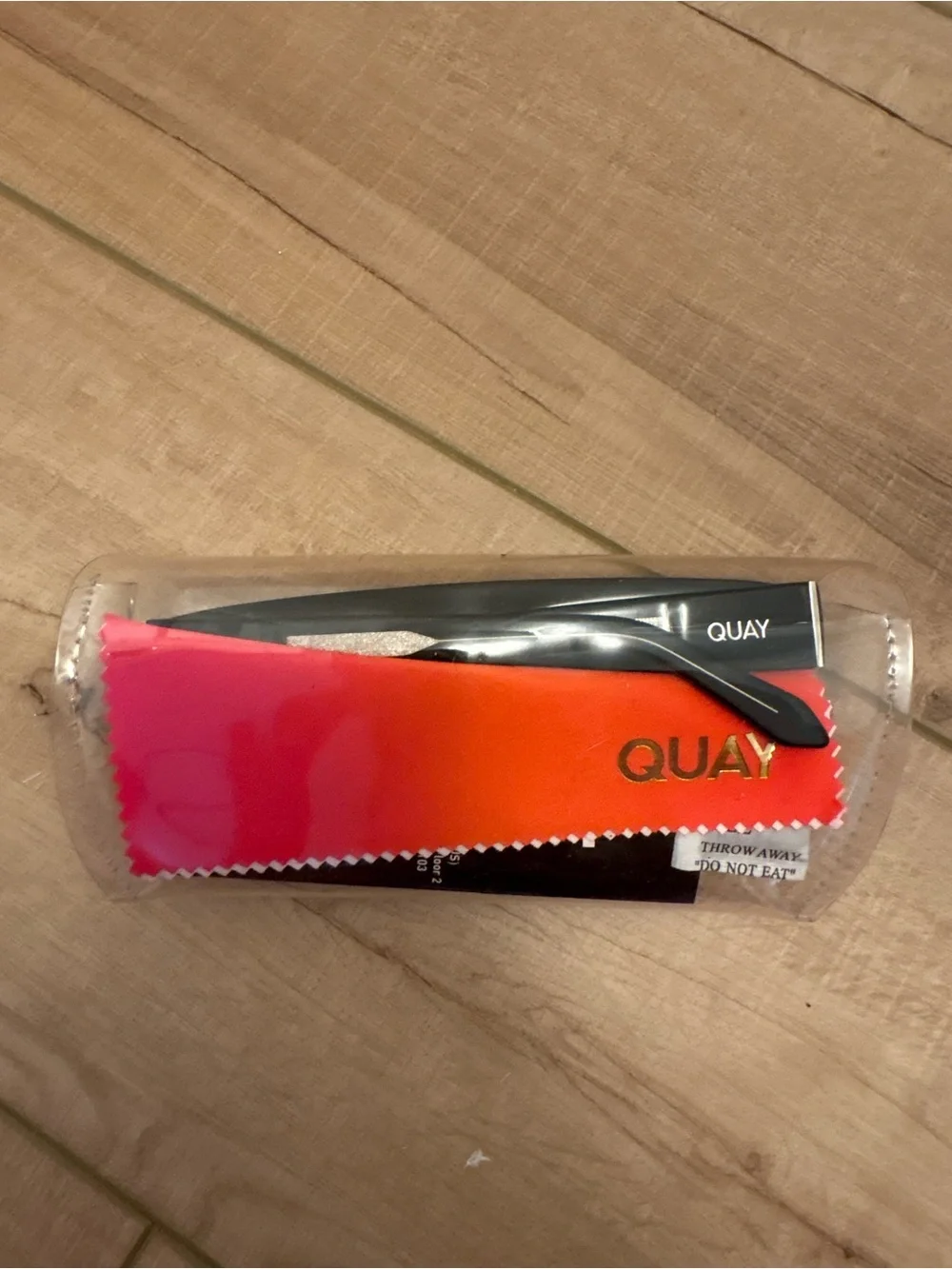 Quay Australia Black Shield Sunglasses with Red-Tinted Lenses
